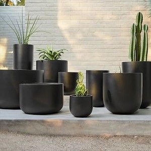 Favorite Large Outdoor Planters For Any Budget and Style Black Outdoor Planters Front Doors, Large Black Planters Outdoor, Black Planters Front Door, Black Pots Planters, Ceramic Planters Outdoor, Black Outdoor Planters, Large Container Planting Ideas, Tall Black Planters, Outdoor Planters Front Door