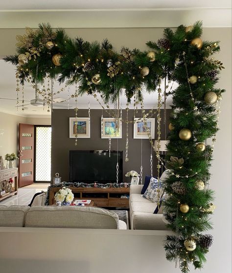 Christmas Decor For Pendant Lights, Ceiling Beam Christmas Decor, Christmas Garland Backdrop, Empty Wall Christmas Decor, Stocking On Wall Ideas, Hallway Decorating Christmas, Arch Christmas Decor, Window Christmas Decor Ideas, Christmas Ceiling Decorations Ideas