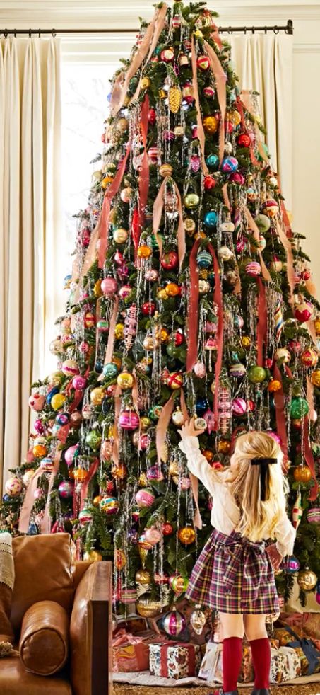 Flocked Colorful Christmas Tree, Rainbow Tinsel Christmas Tree, Holiday Merchandising Retail, Vintage Christmas Exterior Decor, Fabric On Christmas Tree, Whimsical Christmas Aesthetic, Cozy Colorful Christmas, Fun Christmas Tree Decorations, Outdoor Vintage Christmas Decorations