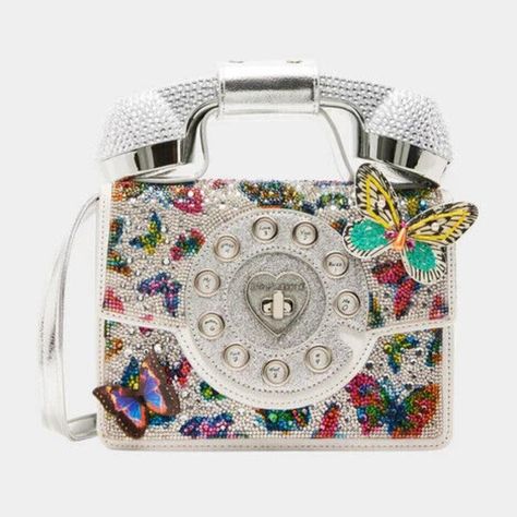 Betsey Johnson Kitsch Silver Butterfly Metallic Phone Crossbody Bag New Sealed Limited Edition Bj35170a *Item Ships Brand New In Original Packaging With Tags. We Are Licensed Sellers. We Sell To Collectors & Betsey Lovers* Betsey Has A New Update To Our Classic Phone Bag. This Version Is Complete With Rhinestone Embellishments And 3d Butterflies. The Phone Handle Detaches, So You Can Make And Receive Calls Wirelessly With Connectivity To Your Cell. Item Ships Brand New In Sealed Package With Tag Funky Purses, Classic Phones, Retro Phone, Girly Bags, Unique Purses, Bag Silver, Wearable Tech, Pretty Bags, Betsey Johnson Bags