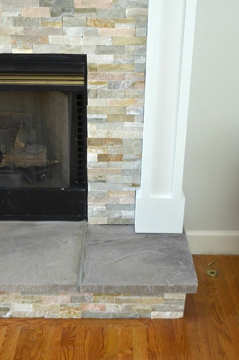 DIY Stone Tile Fireplace Makeover Tile Fireplace Makeover, Fireplace Hearth Stone, Stone Tile Fireplace, Fireplace Hearth Tiles, Tiles Fireplace, Hearth Tiles, Hearth Stone, Stacked Stone Fireplaces, Fireplace Redo