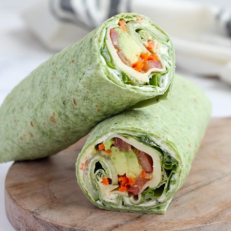 Our Veggie Wraps are made with a delicious, homemade herbed cream cheese and are packed with lots of fresh vegetables. It's a healthy and easy recipe that can be made ahead and are perfect for packed lunches! Green Wraps Tortilla, Cream Cheese Veggie Wrap, High Protein Veggie Wraps, Easy Vegetable Recipes Quick, Easy Veggie Sandwiches, Easy Veggie Wraps, Spinach Herb Wrap Recipes, Veggie Burrito Wraps, Vegetarian Lunch Wraps