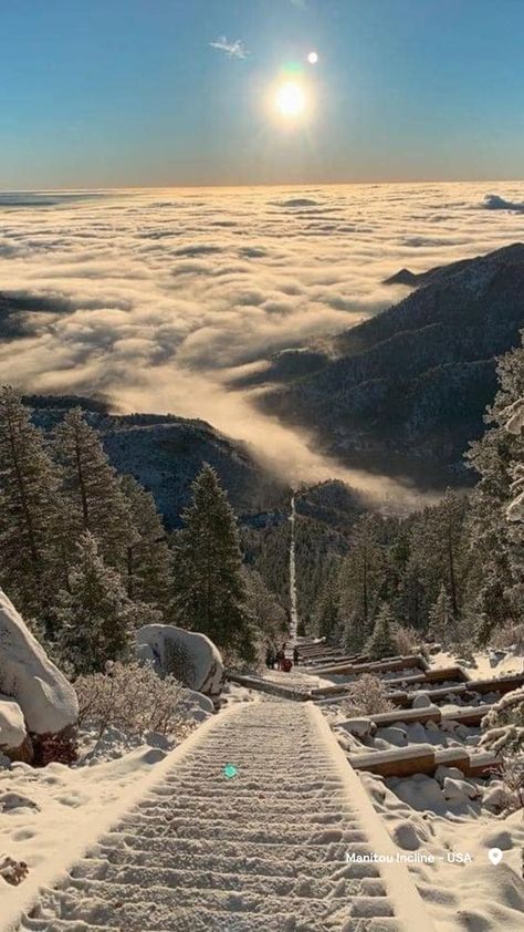 A sea of clouds sits beneath a steep climb of stairs covered in snow at the Manitou Incline. Colorado Springs Aesthetic, Colorado Springs Winter, Manitou Incline, Colorado Aesthetic, Manitou Springs Colorado, Diy Nature, Manitou Springs, Colorado Winter, Family Destinations