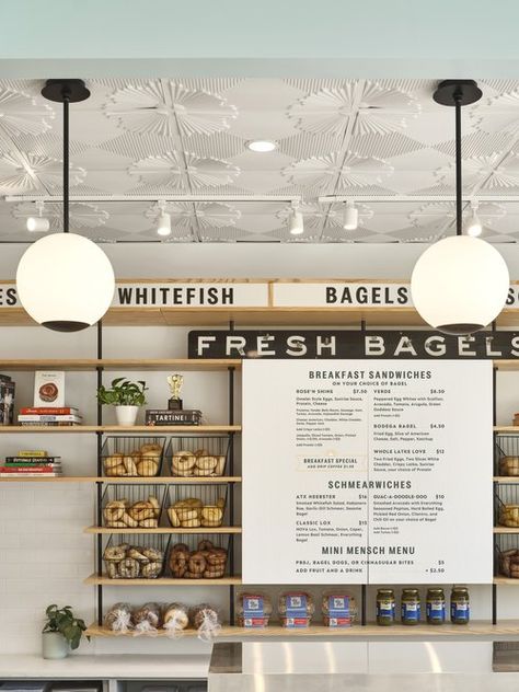 Rosen's Bagels;Lilianne Steckel Interior Design; Bagel shop; white oak store shelving; retail design; cafe design; bagel shop design; light blue and coral; ceiling tile; bagel shelving; order counter; menu board Bagel Shop Design, Coral Ceiling, Bagel Company, Store Shelving, Bagel Cafe, Coffee And Bagel, Bagel Breakfast Sandwich, Bakery Design Interior, Breakfast Cafe