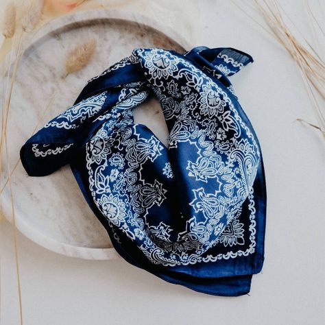 Super silky festival navy blue bandanna scarf. Was 1991 your year of the bandanna scarf? Ours too! Throwback with the Sofie Navy Blue Paisley Bandanna Festival Neck Scarf. The lightweight design will look great with denim (we recommend going all the way with the Canadian tuxedo). Wear in your hair or around your neck. Material: Polyester Dimensions: 75cm L x 75cm W Colour: Navy blue  Polyester Bandana Neck Scarf, Cashmere Winter Scarf, Flame Candle, Bandana Neck, Canadian Tuxedo, Paisley Bandana, 90s Hip Hop Fashion, Winter Scarves, Fall Winter Wardrobe