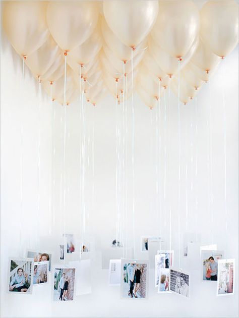 Rather than framing pictures as decorations, suspend them from balloons for a truly entrancing display. Get the tutorial at Wedding Chicks. Creative Bridal Shower Ideas, Engagement Party Diy, Balloon Chandelier, Rustic Wedding Decorations, Diy Balloon, Diy Chandelier, Engagement Party Decorations, 30th Birthday Parties, Wedding Chicks