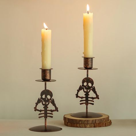 PRICES MAY VARY. Vivid and Adorable Skulls - Embrace the Halloween spirit with these lively and cute candle sticks holder decor, This skeleton stand blends perfectly with the candlestick holder, ideal for enhancing your Halloween decor with a touch of whimsical and playful charm Black with Orange Antiqued Finish - The black candlestick holders with orange antiquing bring a unique Halloween atmosphere to your space, infusing it with a festive vibe that's both striking and eye-catching. Let this H Grinch Candle Holder, Simple Halloween Centerpieces, Skeleton Stand, Candle Stick Holders Decor, Skeleton Candle Holder, Fireplace Dining Room, Skeleton Candle, Black Candlestick Holders, Gothic Candle Holder