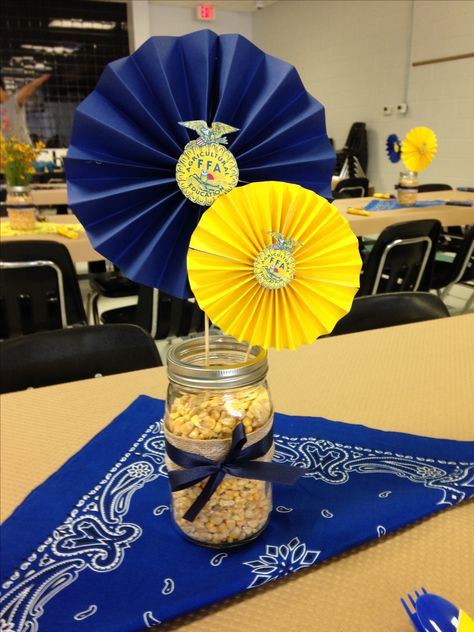 FFA Banquet centerpieces. Had them with jars of wild yellow flowers-inexpensive! Ffa Party Decorations, Ffa Balloon Arch, Banquet Decorations Table, Ffa Barnwarming Decorations, Ffa Photo Booth, 4h Banquet Decorations, Ffa Banquet Table Decorations, Ffa Table Decorations, Ffa Senior Table Ideas