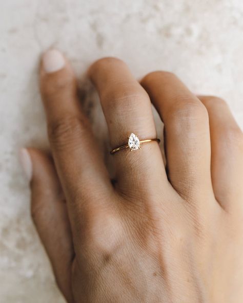 A pear-shaped solitaire (6x4mm) subverts tradition but does it with class. Minimal Engagement Ring, Pear Shaped Ring, Future Engagement Rings, Minimal Ring, Pear Ring, Engagement Ring Shapes, Pear Engagement Ring, Big Rings, Detailed Ring