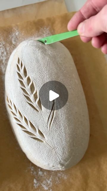 Daniel Larsson on Instagram: "The act of scoring sourdough is like the moment before a kiss – full of anticipation and tenderness, where a simple touch can create something beautiful and profound. 💋
Signed: A cheesy bread romantic.

#BreadScoring #ArtisanBread #SourdoughLove #BreadArt #CrustyLoaf #BakingJoy #Aourdough" Bread Scoring Patterns Loaf, Artistic Sourdough Bread, Leaf Sourdough Scoring, Bread Stencils Design, Oval Loaf Scoring, Bread Loaf Scoring, Artisan Bread Scoring Patterns, Fancy Sourdough Scoring, Sourdough Score Ideas