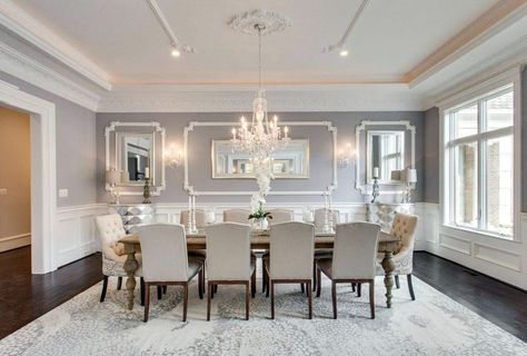 Elegant gray formal dining room with wainscoting and crystal chandelier Formal Dining Room Decor, Dining Room Wainscoting, White Chairs, Dining Room Remodel, Grey Dining Room, Dining Room Wall Decor, Beautiful Dining Rooms, Luxury Dining Room, Elegant Dining Room