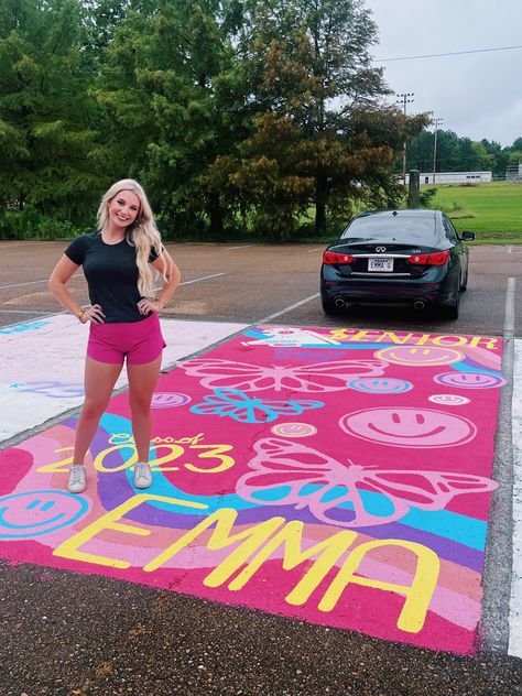 My senior parking spot!!! Smiley faces, butterflies, pink, preppy, all my fav things!!! 💖💖🦋😇 Hot Pink Senior Parking Spot, Rainbow Parking Spot, Graffiti Senior Parking Spot, Hot Pink Parking Spot, Senior Parking Spots Butterfly, Colorful Senior Parking Spots, Senior Parking Space Ideas Butterfly, Cute Parking Spot Paintings Senior, Parking Lot Senior Painting