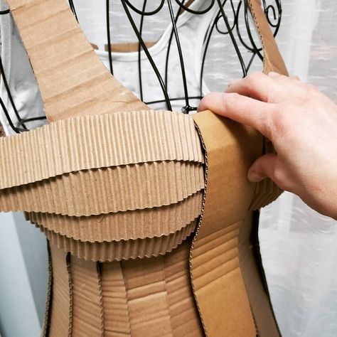 Recycle.Fold. Curve. Cut. Adjust. Glue. Repeat... Working on a wearable cardboard dress💚  #alinescardboard #cardboard #fashionweek… Cardboard Fashion Design, Cardboard Corset Pattern, Cardboard Corset, Recycled Dress Ideas Creative, Recycling Dress, Wearable Cardboard, Chess Costume, Cardboard Fashion, Cardboard Cosplay