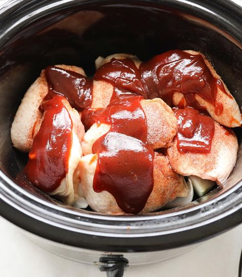 Grab your crock pot and just four ingredients, and get ready to dig into these ultra tender and flavorful BBQ Chicken Thighs! Cooking chicken thighs in the slow cooker makes them absolutely delicious, with hardly any work at all! Crock Pot Bone In Chicken Thighs, Bone In Chicken Thigh Crockpot Recipes, Slow Cooker Boneless Skinless Chicken Thighs, Slow Cooker Bbq Chicken Thighs, Chicken Thighs In Crockpot Recipes, Chicken Thighs Crockpot Bone In, Crockpot Chicken Thighs And Potatoes, Crock Pot Boneless Chicken Thighs, Slow Cooker Thighs