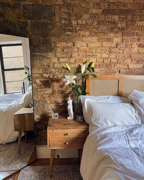 Small nyc apartment with exposed brick. White and clean decor. Brick Interior Apartment, Brick Boho Bedroom, Bedroom Ideas Exposed Brick, Apartment Decorating Brick Wall, New York Exposed Brick Apartment, New York City Apartment Studio Brick Walls, Bedroom With Red Brick Wall, Exposed Brick Loft Bedroom, Exposed Brick Apartment Decoration