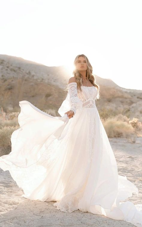 For the bride with a free-spirited style that’s anything but ordinary, the maddox gown brings its unique personality down the aisle (or the beach) with its soft A-line silhouette and stunning combination of matte lace and crepe chiffon. Allwhowander Bridal, Off The Shoulder Boho Wedding Dress, All Who Wander Wedding Dress, Australia Wedding Dress, Blue By Enzoani, Column Wedding Dress, Boho Wedding Gowns, Bridal Shops, Something Blue Bridal