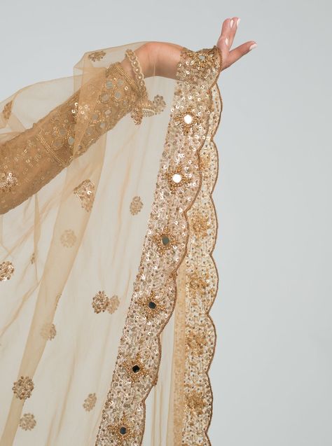 Once Upon A Time Collection. Soft Net. Mirror Work. Hand Embroidery. The Caramel Cinema Dupatta encompasses timeless mirror work nested within gold hand sewn beads on the scalloped border. This shimmering fabric has sequins detailing spread throughout the soft net for added texture. Standard Dupatta: 42 in x 95 in Work Dupatta Designs, Mirror Work Dupatta, South Asian Fashion, Abhinav Mishra, Scalloped Border, Indian Aesthetic, Gold Hand, Gold Hands, Mirror Work