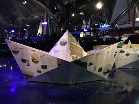 Exhibit info at this maritime museum is printed onto giant paper boats Boat Exhibition, Maritime Museum Design, Origami Ship, Boat Bar, Paper Boats, Museum Exhibition Design, Marine Theme, Museum Displays, Paper Boat