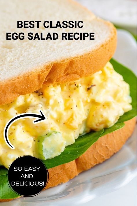 A closeup of an egg salad sandwich with spinach on white bread. Crunchy Egg Salad Recipe, Egg Salad With Green Onions, Egg Salad With Cheese, Egg Salad Recipe With Celery, Egg Salad Recipe With Pickles, Celery Breakfast, Egg Salad With Celery, Celery Pickles, Creamy Egg Salad