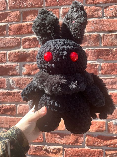 Fill your inner [ V O I D ] with this precious handmade Mothman plushie! Your Mothman buddy can be made in various color combinations, depending on availablity. Message me for requests and we can talk about colors. Made to order, work time is 3-5 business days before shipping. Made with regular and fluffy polyester yarns, polyfil, safety eyes, and wooden skewers. **Not recommended for small children.** Mothman pattern and red safety eyes by Mom's Stitchetti. Moth Man Crochet Pattern, Mothman Crochet Pattern, Cryptid Crochet Pattern, Mothman Crochet Pattern Free, Cryptid Crochet, Crochet Mothman, Mothman Crochet, Cryptidcore Aesthetic, Car Customization