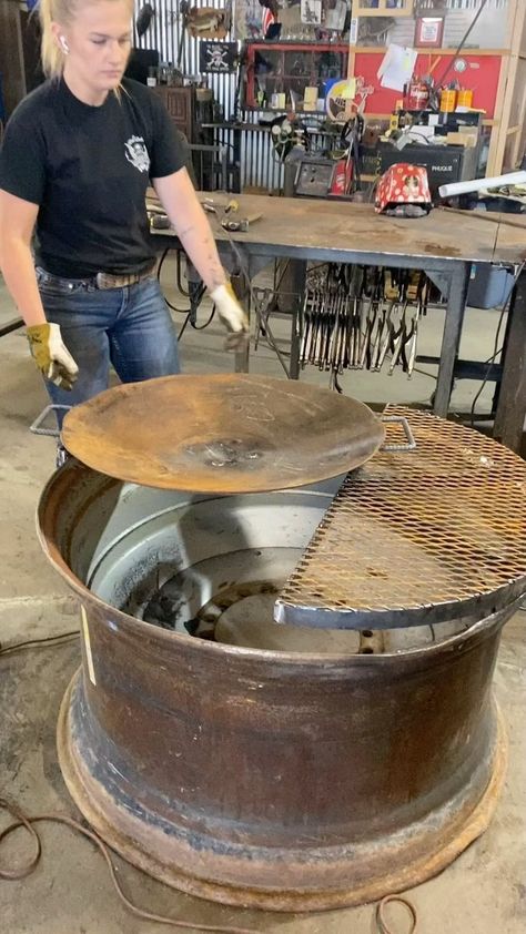 Go big or go home! Massive fire pit on a 45” tractor wheel. Get ready for some cooking @milnescrystal @mak_themaker @makenzymartin @bennett_subach all pitched in. This thing is really cool!! #cooking #firepit #firefeature #homesteading #outdoorcooking | Atomic Forge & Welding Inc. Tractor Wheel Fire Pit, Tractor Rim Fire Pit Ideas, Fire Pit Grill Ideas, Fire Pit Cooking Grill, Bbq Grill Diy, Forge Welding, Rim Fire Pit, Bbq Fire Pit, Grill Diy