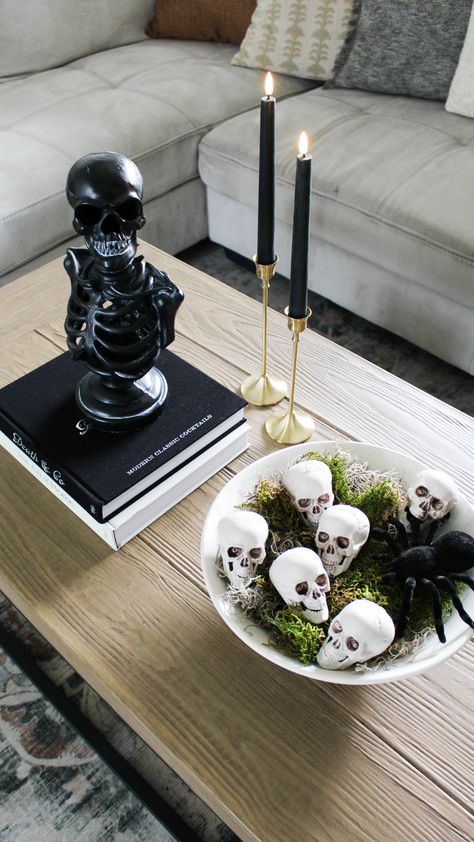 Skeleton decor. Skulls bowl filler. Spider decor. Goth Coffee Table Decor, Witchy Coffee Table Decor, Halloween Decor Centerpiece, Black Led Candles, Halloween Decor For Coffee Table, Cb2 Halloween, Halloween Shelf Styling, Halloween End Table Decor, Easy Halloween Centerpieces For Table