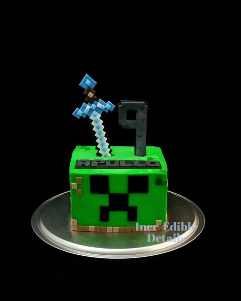 Minecraft creeper style birthday cake with fondant sword topper and details Minecraft Creeper Cake Ideas, Minecraft Cake Without Fondant, Minecraft Creeper Birthday Cake, Creeper Birthday Cake, Minecraft Square Cake, Creeper Cake Minecraft, Creeper Minecraft Cake, Minecraft Dungeons Cake, Minecraft Birthday Cake For Boys