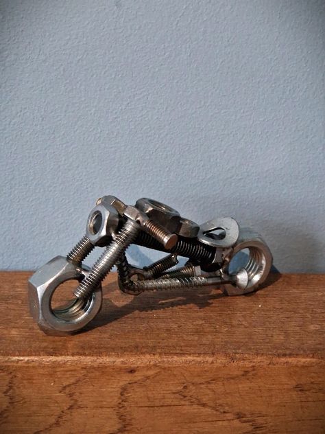 Handcrafted scrap metal sculpture of a motorbike made from nuts and bolts which have been welded together.  Would make a great piece for the home or a great gift for someone who loves their bikes.  Has been clear coated for a smooth and shiny finish. Nuts And Bolts Art, Welding Sculptures, Weld Art, Scrap Metal Sculpture, Welding Crafts, Recycled Metal Art, Nut Bolt, Welding Art Projects, Metal Art Diy