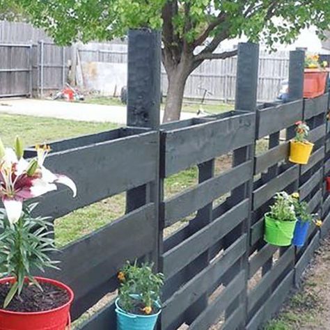 95 likes, 3 comments - offgridworld on March 17, 2020: "Here’s another really cool pallet fence from our recent article. I love how the colored pots an..." Pallet Fence, March 17, Off Grid, Off The Grid, Pallet Projects, Wood Pallets, Fence, Thinking Of You, I Love