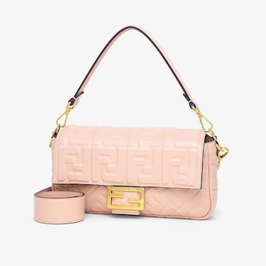 Iconic medium Baguette bag made of soft, pink nappa leather with a three-dimensional textured embossed FF motif. Decorated with an FF clasp. Featuring a front flap, magnetic clasp, internal compartment with zip pocket and vintage gold-finish metalware. The bag can be carried by hand, or worn either on the shoulder or cross-body thanks to the handle and shoulder strap, both detachable. Made in Italy. One Size Pink Fendi Baguette, Fendi Baguette Mini, Pink Fendi, Fendi Baguette Bag, Fendi Logo Design, Fendi Store, Dream Bags, Fendi Logo, Fendi Baguette