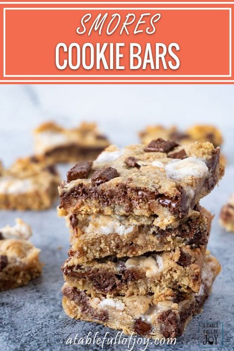 S’mores Cookie Bars are a delicious and easy treat this summer and fall! Perfect for a crowd or just a delicious dessert after dinner! #cookie #cookiebar #chocolate #smore #marshmallow #atablefullofjoy #easy #forkids #best Gooey Cookie Bars, Bars For A Crowd, Smores Cookies Bars, Easy Smores, S Mores Bars, Gooey Cookies, Easy Treat, S'mores Bar, Sweet Cookies