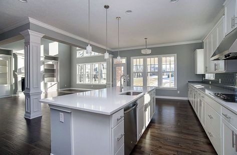 Contemporary kitchen with arctic white quartz countertops, white cabinets, gray walls and tile backsplash Blue Gray Kitchen Cabinets, Grey Painted Kitchen, White Cabinets White Countertops, Cabinets Gray, Grey Kitchen Walls, Grey Blue Kitchen, Best Kitchen Colors, Light Grey Kitchens, Dark Grey Kitchen