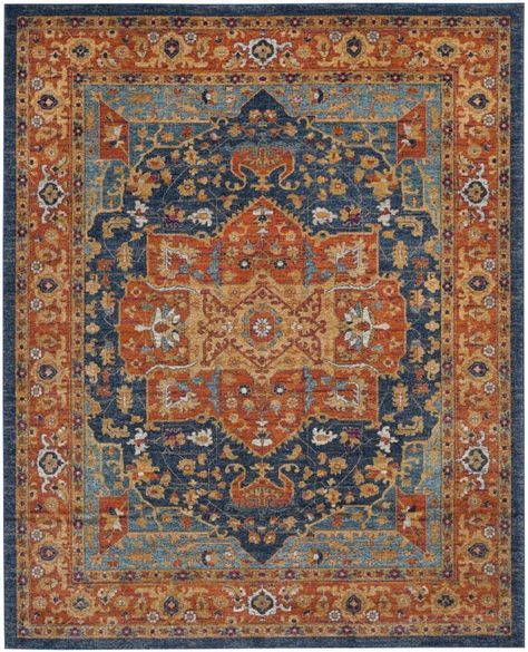 Construction: 66% Polypropylene, 27% Jute, 5% Polyester, 2% Cotton. Full Dimensions: 9-ft x 12-ft. Pile Height: 0.37-in. Rug Weight: 52 lbs. Power Loomed. Made in Turkey. Rug Pad Recommended. Vacuum regularly, spot clean with mild detergent, professionally dry clean. 30 Day Limited Warranty. Safavieh Evoke Livia 9 x 12 Blue/Orange Indoor Distressed/Overdyed Global Area Rug Polyester | EVK275C-9 Office Area Rugs, Safavieh Rug, Orange Rug, Plush Rug, Orange Area Rug, Transitional Rugs, Carpet Colors, Orange Rugs, Vintage Area Rugs