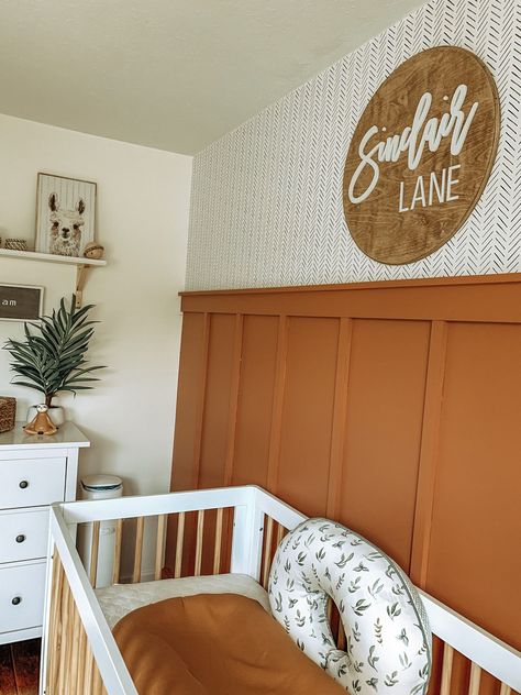 Boho Neutral Nursery in rust and white #nurserydecor #nurseryideas #nursery #babynursery Rust Nursery Ideas, Boho Accent Wall Nursery, Modern Southwest Nursery, Rust Gender Neutral Nursery, Orange Accent Wall Nursery, Rust Nursery Decor, Orange Nursery Ideas Gender Neutral, Fall Theme Nursery, Rust Orange Nursery