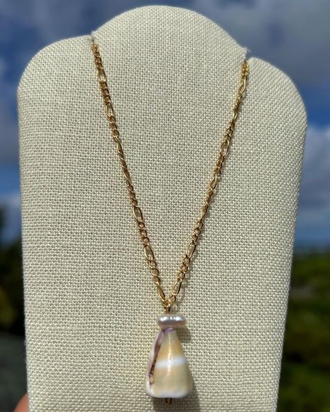 Cone Shell & Freshwater Pearl Necklace✨ Add a touch of island charm! This 14k gold filled or sterling silver necklace features a detachable pendant showcasing a beautiful Hawaiian cone shell and freshwater pearl. 🐚 With a durable 16” chain, this necklace is perfect for everyday wear. No tarnishing or water damage! Available in my shop 🌊☀️🌺🥥 #coneshell #hawaiiconeshell #freshwaterpearls #pearlnecklace #shellnecklace #14kgold #sterlingsilver #naturalfinds #handmadejewelry Detachable Pendant, Cone Shell, Freshwater Pearl Necklace, Water Damage, Freshwater Pearl Necklaces, Shell Necklaces, Sterling Silver Necklace, Sterling Silver Necklaces, Freshwater Pearls