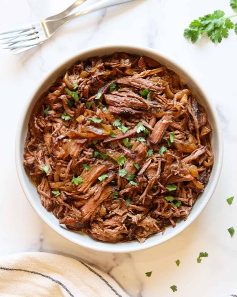 Crockpot Mexican shredded beef is super easy to make and takes only 15 minutes of hands on time to prepare! Plus, it's extremely versatile and freezer friendly so you can make it in bulk and store for months. This comes in handy when you need a quick, easy dinner. Use your pulled beef to make tacos, nachos, quesadillas, burritos, burrito bowls, enchiladas, taco salad and more! It's even gluten free, dairy free, low carb and high protein. Beef Stew Meat Burritos, Mexican Pulled Beef, Slow Cooker Mexican Shredded Beef, Beef Brisket Slow Cooker, Shredded Beef Recipe, Crockpot Mexican, Shredded Beef Recipes, Slow Cooker Mexican, Shredded Beef Tacos