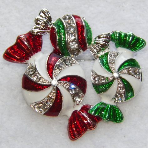 ~Festive Silver Peppermint Candy Christmas Pin ~Shiny Red & Green Epoxy & White Enamel Stripes ~Sparkling Crystal Rhinestone Accent Stripes ~1 3/4" With Secure C-Clasp Closure ~Presented In Silver Snowflake Organza Gift Pouch ~Happy Holidays ~General Cleaning Instructions: Wipe With A Damp Cloth, Dry With A Soft Cloth. Do Not Immerse In Water Or Jewelry Cleaner. ~Thank You For Your Interest In This Item! ~Please Shop All My Closet Items! ~Follow Me For Future Finds! Christmas Jewerly, Christmas Brooches, Peppermint Christmas, Jeweled Christmas, Christmas Brooch, Holiday Pins, Silver Snowflakes, Saint John, Christmas Pins