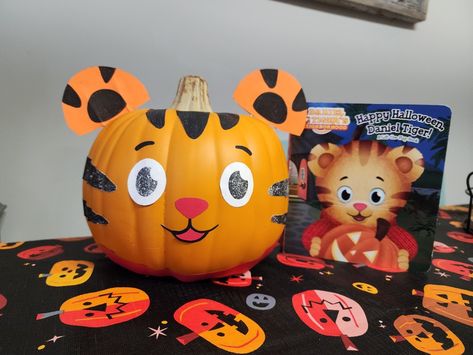 Daniel Tiger inspired pumpkin. Happy Halloween, Daniel Tiger. Kindergarten project. Elementary school projects. Pumpkin ideas. Decorating pumpkins. Daniel Tiger Pumpkin Painting, Pumpkin Ideas Decorating, Daniel Tiger Pumpkin, Tiger Pumpkin, Elementary School Projects, Story Book Pumpkin, Tiger Halloween, Pumpkins Kindergarten, Decorating Pumpkins