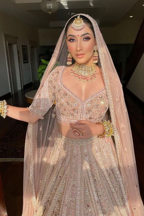 Bride in a pastel lehenga coupled with jJadau jewellery! Pastel Bridal Lehenga, Pastel Lehenga, Pink Bridal Lehenga, Indian Wedding Bride, Latest Bridal Lehenga, Indian Outfits Lehenga, Wedding Lehenga Designs, Indian Bride Outfits, Bridal Lehenga Collection