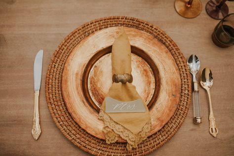 Thrifted decor, wicker charger plate, with gold charger plate on top and accented with gold and silver flatware. Wedding Plate Setting, Thrifted Wedding, Wedding Plate, Gold Charger Plate, Yellow Napkins, Thrifted Decor, Gold Decorations, Gold Chargers, Gold Flatware