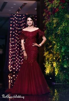 The cocktail gown is the most chosen dress by the Indian brides for their cocktail or sangeet ceremony. The trending cocktail gowns from Vibrant gowns to shimmery gowns to mermaid gowns to pastel gown Indian brides are loving these gowns for their Indian wedding. To all the bride-to-be, take note for your Indian wedding inspiration. #indianwedding #cocktailgown #sangeetgown #gownforwedding #bridalgown #trendingweddinggowns #bridalgownideas #bridalinspiration #bridallehenga #lehengacholi Sangeet Gown, Vestidos Color Vino, Indian Wedding Reception Outfits, Winter Wedding Gowns, Bridal Gown Inspiration, Reception Gowns, Wedding Frocks, Indian Wedding Gowns, Reception Outfit