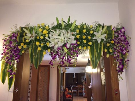 Door decorations can make celebrating a special occasion on your cruise even more fun, whether it is a birthday, anniversary, retirement, family reunion or any other event. It also sets the tone for interior décor. If you are thinking of door decoration with flowers, we can help you fulfill your dream. We are a supplier of wholesale flowers for a door decoration. Reach to us: https://bit.ly/2OPmtxt Flower Decoration For Door Entrance, Front Door Flower Decoration Indian, Vastu Shanti Pooja Decoration, Entrance Door Flower Decoration Indian, Door Flower Decoration Indian, Main Door Flower Decoration Indian, Door Decoration With Flowers, Gate Decoration With Flowers, Flower Mala