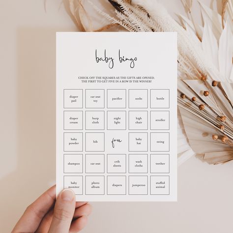 "Black & White Baby Shower Bingo Game Print on kraft paper for a rustic look. Let not only the mom-to-be enjoy unpacking gifts! Play Bingo with these modern minimalist baby bingo cards. Check off the squares as the gifts are opened. The first to get five in a row is the winner! The minimalist baby bingo game has everything you need to play Baby Bingo in multiple ways. A blank card to be filled in by your guests and 30 different pre filled bingo cards with calling sheet to make things easy. This baby shower bingo game is an instant download. Within minutes of your order and payment, an e-mail will be sent to the address you have associated with your Etsy account with a link for your download.   You can also access the files from your recent purchases on Etsy. Print the cards right from your Baby Shower Gift Game, Funny Baby Shower Games For Men, Black Baby Shower Games, Baby Bingo Game, Baby Shower Bingo Game, Black And White Baby Shower Ideas, Simple Baby Shower Games, Baby Shower Game Gifts, Easy Baby Shower Games