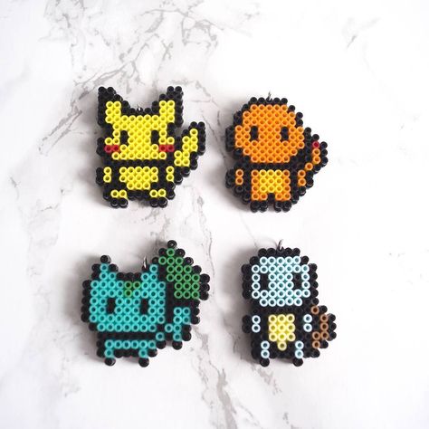 Pokemon starter mini perler bead sprites- pikachu, charmander, bulbasaur, squirtle Beads Ironing, Perler Bead Patterns Pokemon, Perler Bead Pokemon, Pokemon Starter, Starter Pokemon, Pokemon Perler, Pokemon Bead, Hamma Beads Ideas, Pokemon Perler Beads