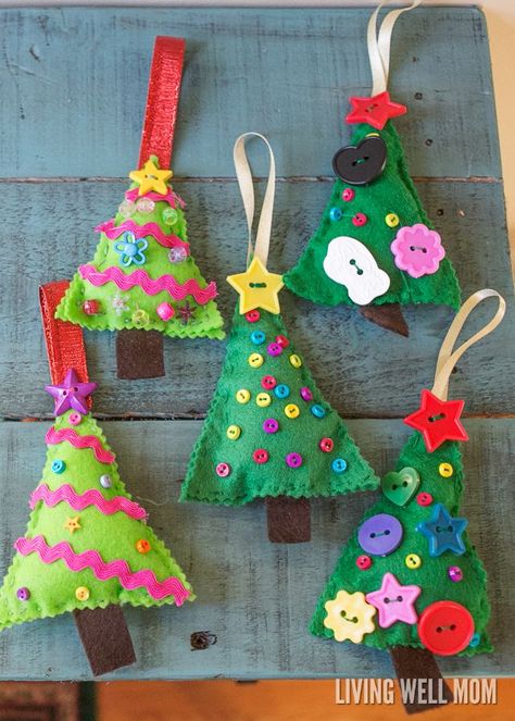 Felt Christmas Tree Ornaments are a perfect first sewing project for kids as young as 4 years. Easy to make, this craft can be customized and enjoyed all the way up to adults! Sewing Project For Kids, Felt Christmas Tree Ornaments, Christmas Tree Ornaments Felt, Christmas Tree Ornament Crafts, Sewing Felt, Juleverksted For Barn, Felt Ornaments Diy, Felt Christmas Tree Decorations, First Sewing Projects