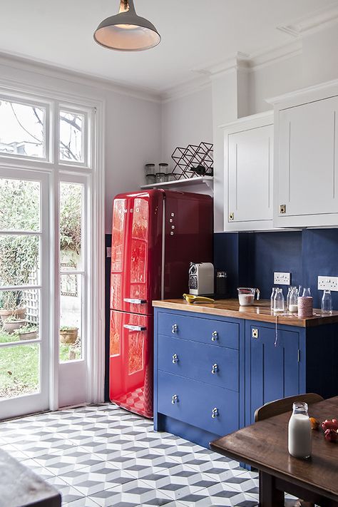 We love the kitchen's red Smeg fridge and overall homemade look.  #Kitchen #Colorful #ColorfulKitchen #BlueCabinets #BlueKitchen #BluePaint #PaintedCabinets #KitchenCabinets #KitchenRemodel #KitchenRemodeling #Remodeled #KitchenRemodeled #KitchenTiles #RedFridge #KitchenFridge #Fridge #Refrigerator #RedRefrigerator #Appliances #KitchenAppliances #Retro #RetroFridge #RetroDesign #RetroKitchen #RetroInteriorDesign Red Fridge Kitchen, British Standard Kitchen, Chestnut Kitchen, Red Fridge, Red Refrigerator, Smeg Refrigerator, Smeg Kitchen, Full Kitchen Remodel, Ideas Baños