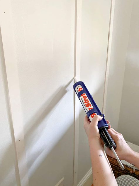 How to create a board and batten wall in a small entryway the easy way with lattice and black paint to create a dramatic entrance. Board And Batten Wall Using Lattice, Lattice Trim Board And Batten, Entryway Board And Batten Hooks, Easy Bathroom Accent Wall, Painting Board And Batten Walls, Lattice Board And Batten, Easy Board And Batten Wall, Easy Board And Batten, Diy Board And Batten Wall