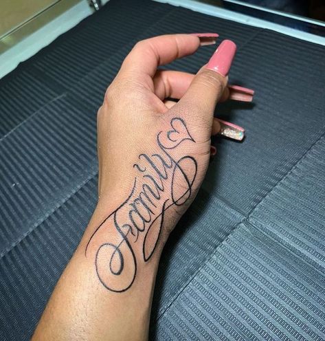 Family Hand Tattoo For Women, Name Tattoo On Forearm For Women, Hand Tattoos Names, Name Hand Tattoos For Women, Side Hand Tattoos Words, Hand Tattoos For Women Words, Name Tattoo On Buttcheek, Alex Tattoo Name, Hand Word Tattoos