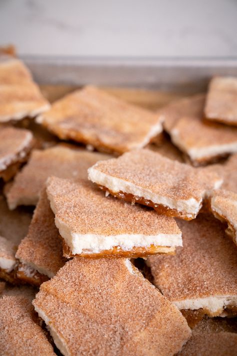 Churro Cracker Candy | 12 Tomatoes Churro Cracker Candy 12 Tomatoes, Churro Bars Recipe, Cinnamon Graham Cracker Recipes, Churro Cracker Toffee, Quick Homemade Snacks, Sweet Saltine Cracker Recipe, Churro Cracker Candy, Churro Crackers, Candied Tomatoes