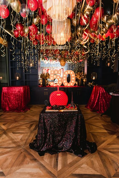 This spectacular red and gold 50th birthday party was a festive celebration filled with elegant décor and unique details. Held at 101 north eatery in Westlake Village, California, this event featured red and gold balloons, large red rose centerpieces, elegant gold platters, enormous marquee letters, and a detailed birthday cake. XO Bloom planned all of the décor and florals seen at this glamorous birthday party which created a cohesive, memorable event. Red And Black Event Decor, Red 60th Birthday Ideas, Black And Red 50th Birthday Party Ideas, Roses Birthday Theme, Black Gold And Red Party Decorations, Roses Themed Birthday Party, Red And Gold Birthday Party Decoration, 50th Birthday Party Ideas For Woman, Red And Gold Centerpieces